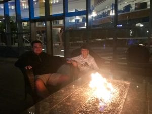 Child with autism relaxing around the fire at Sawgrass Marriott after a long day