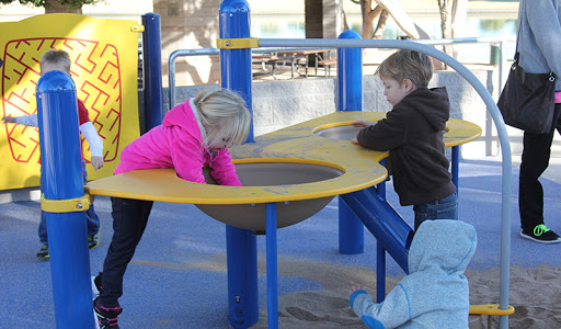 8 kids playing on playground in park in mesa arizona