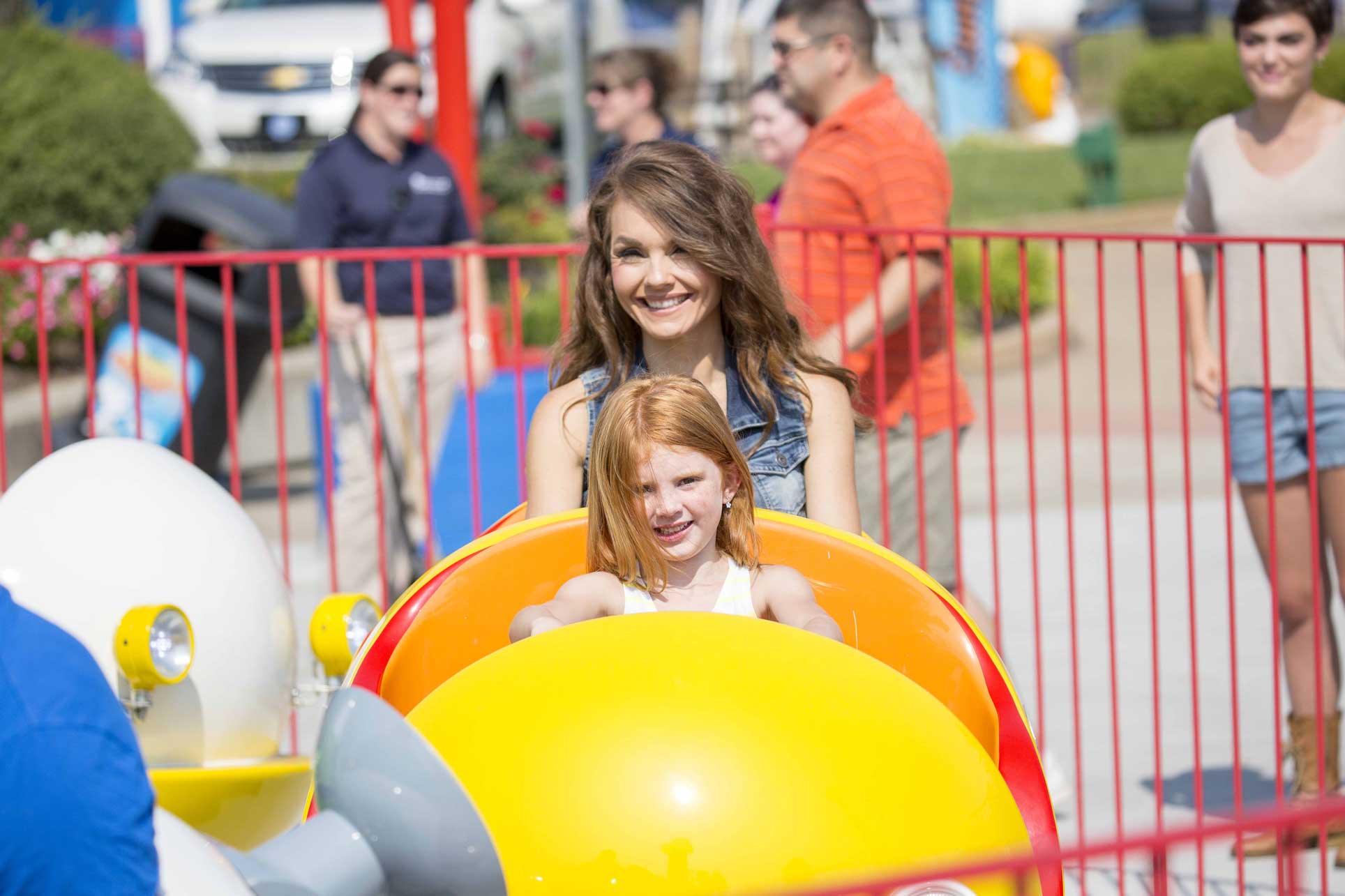 mom and daughter on ride at Kings Island