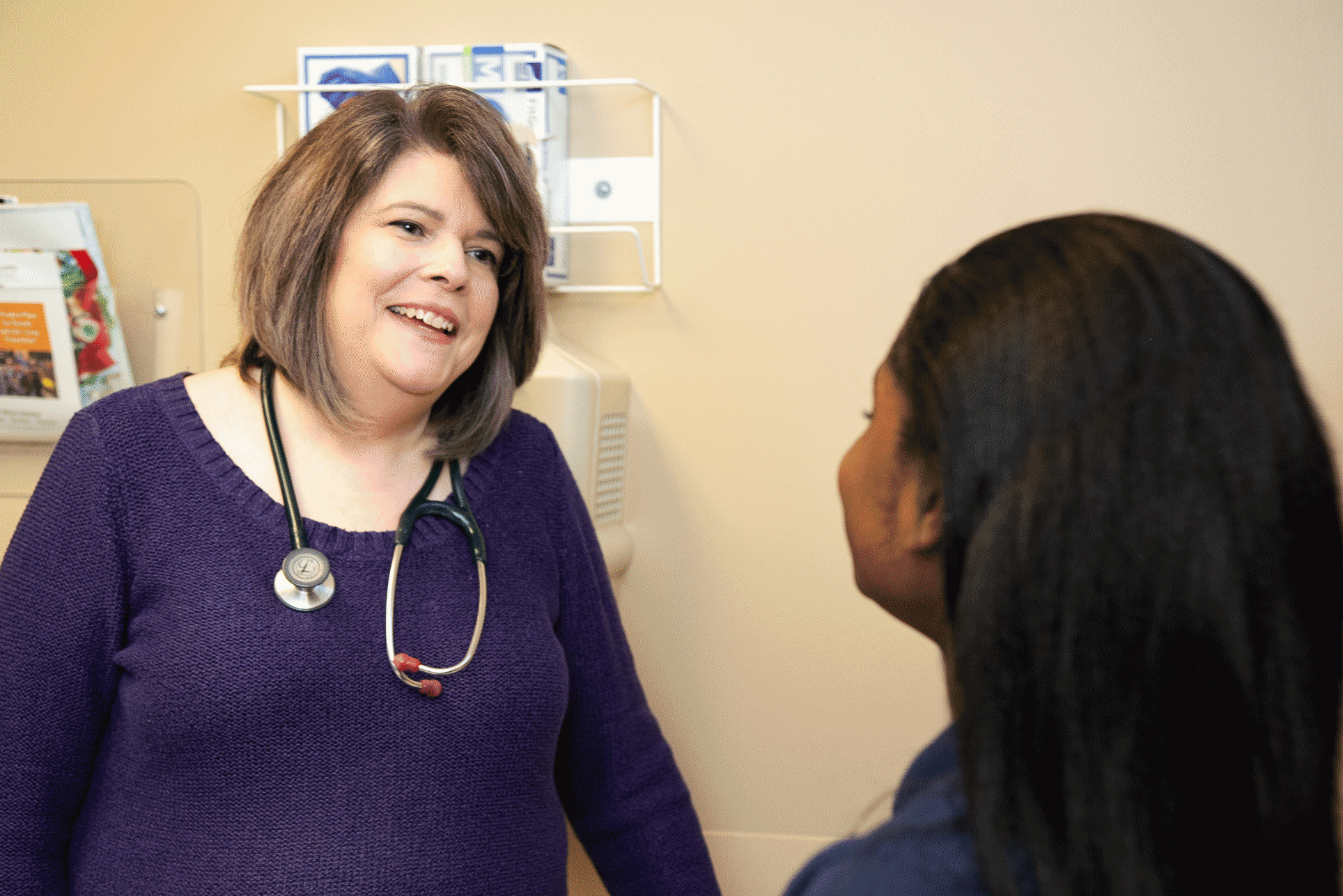 doctor talking with patient at St. Tammany Pediatrics Clinic