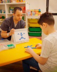 First Step staff working with young boy