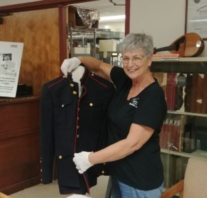 PCHM staff member handling military uniform