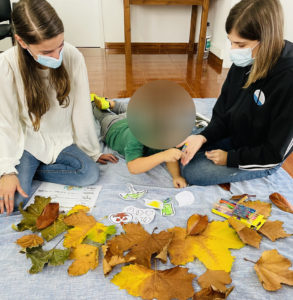 Therapists Assisting a Child