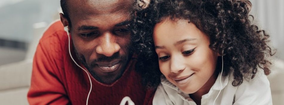 Auditory autism father and daughter listening to music