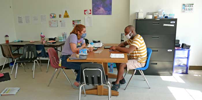 Firefly Autism staff with student