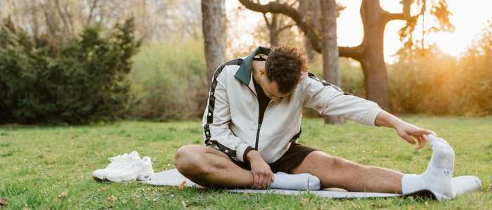 man stretching, coping strategies during travels